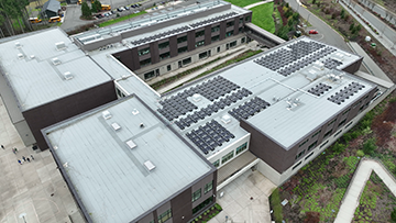 Aerial view of rooftop solar panels at Pine Lake Community Solar generation site